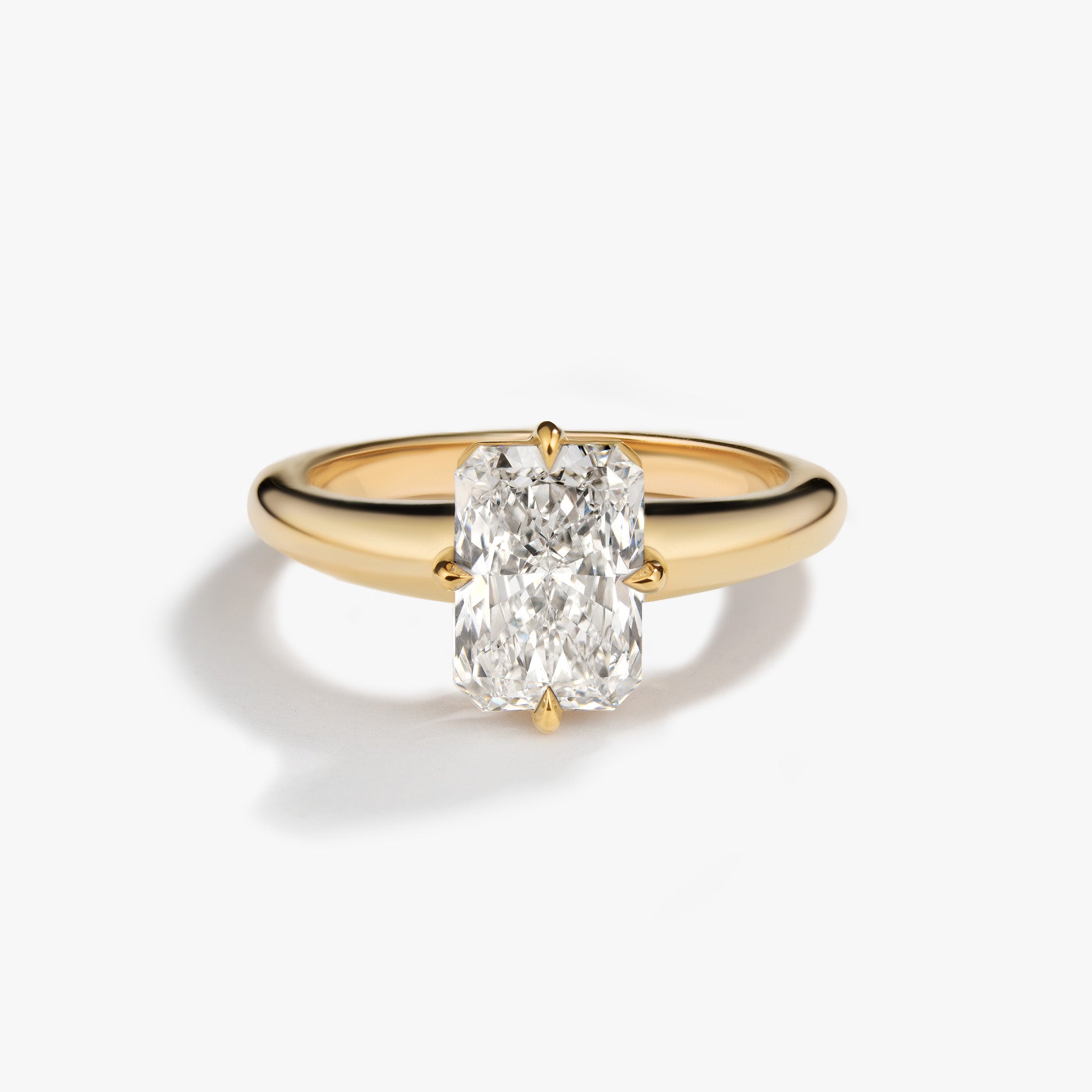 Round tapered thick band engagement ring with radiant diamond